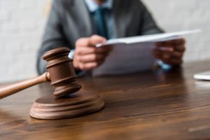Judge reviewing divorce documents that will demonstrate the benefits of a trust after a divorce