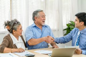 An elderly couple discussing trust options with a lawyer.