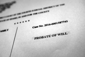 A black and white estate document with the text “Probate Of Will” at the focal point.